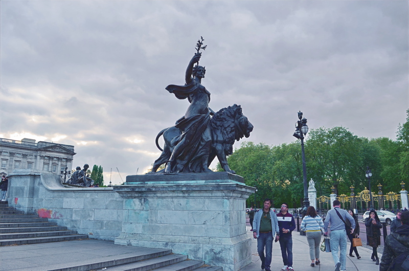 17 - The bronze statue of Peace, one of the allegorical figures sculpted by Sir Thomas Brock as part of the Victoria Memorial located outside Buckingham Palace in London